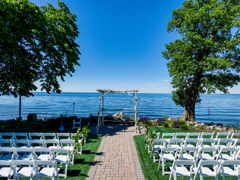 Cinematic drone reveal of reception venue with uplighting