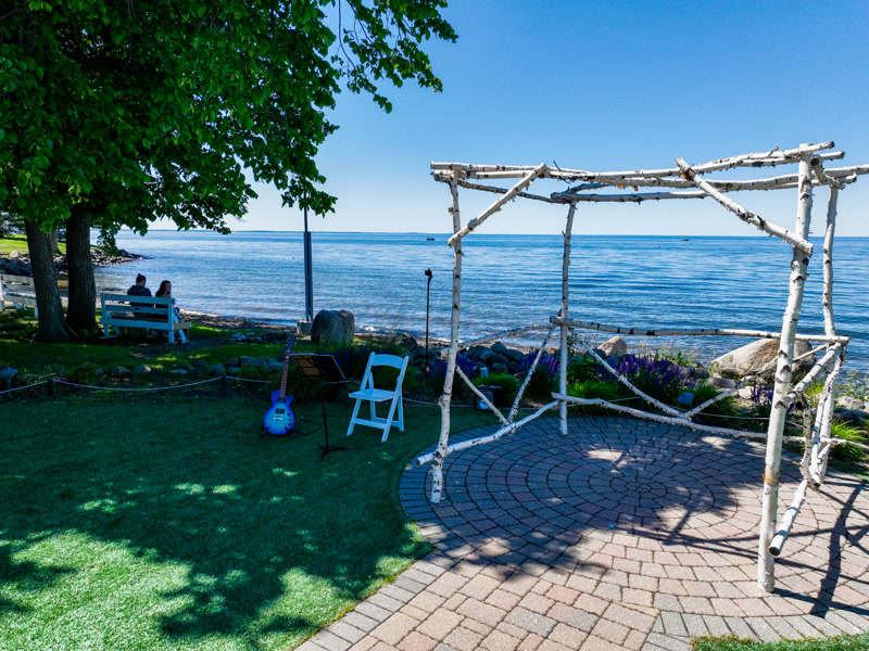Bird's-eye view of ceremony aisle leading to lakeside altar