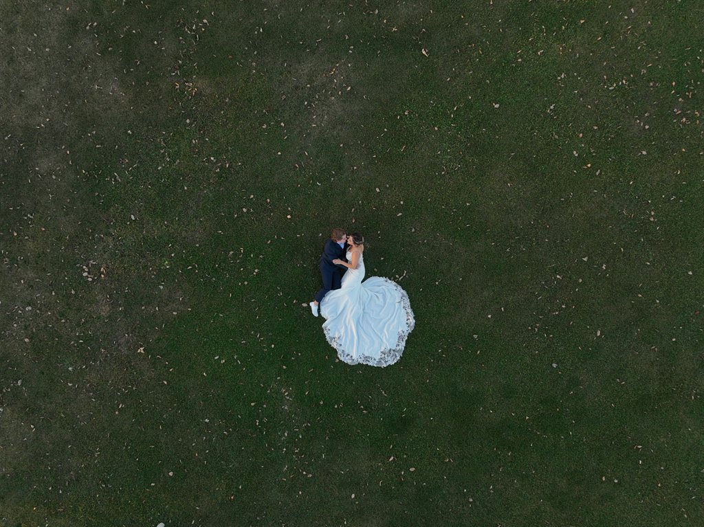Wedding couple during golden hour captured by photo and video team